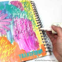 How to take an ugly art journal page and make it better with glitter and a stencil